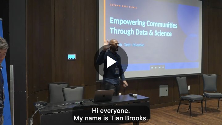 The talk video playing picture-in-picture, with captions.